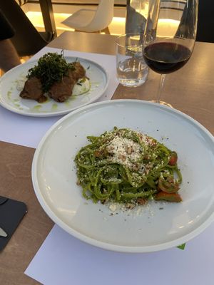 Purple eggplant roll w/ vegan feta sauce & linguine w/ fresh pesto + vegan parmesan. at 5SENSES Restaurant in Santorini