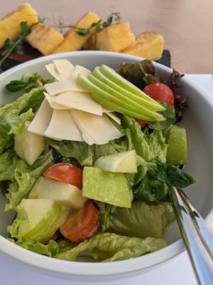 Fruity sensation salad with sliced vegan cheese at 5SENSES Restaurant in Santorini