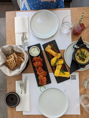 Left to right: pita, tomato fritters, saganaki cheese, fava at 5SENSES Restaurant in Santorini