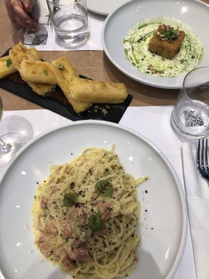 2 appetizers (left to right: saganaki and polenta) - and carbonara   at 5SENSES Restaurant in Santorini