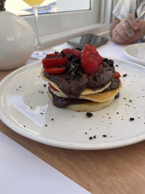 Chocolate mound. Chocolate strawberries are amazing. The pancakes aren’t the light, fluffy, airy style. More dense and dough-cake like. Very sweet, but of course expected   at 5SENSES Restaurant in Santorini