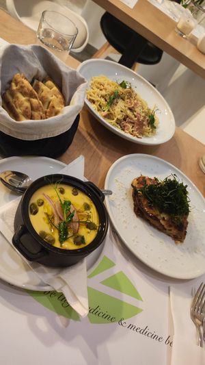 clockwise - pita bread, carbonara, moussaka, fava at 5SENSES Restaurant in Santorini