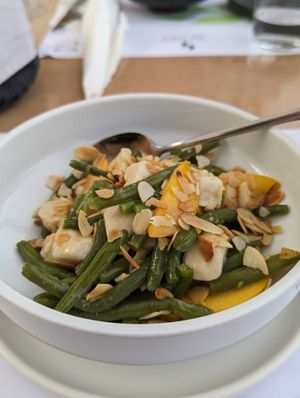 Nanobean.. Peach, Green beans, vegan burrata and almonds   at 5SENSES Restaurant in Santorini