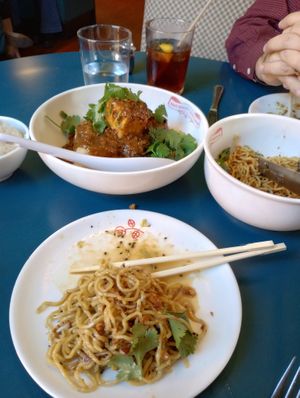 super garlicky noodles in foreground, crispy soft tofu in impossible mapo sauce in background at Best Quality Daughter in San Antonio