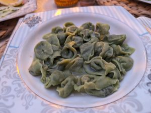 Spinach manti, no dressing. They ran out of yogurt but provided a small tomato salsa at Fatma Sultan in Antalya