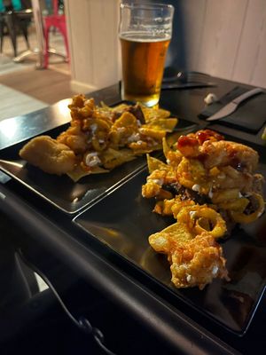 Coliflower wings, nachos, potatoes, and seitan at Faroles Taberna Rock in Valladolid