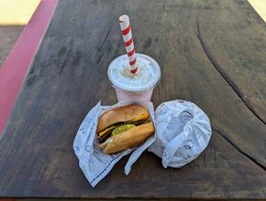 Two for Thursday burgers and a strawberry shake. at Project Pollo - Anderson Lane in Austin