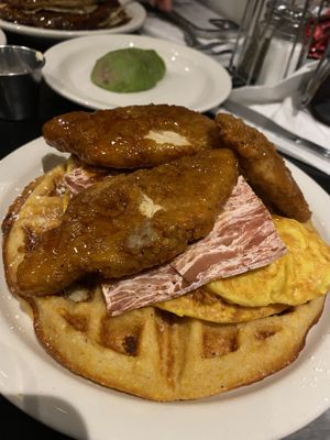 Cornmeal & cheddar waffle topped with buffalo maple chicken with bacon and JUST egg 😋  at Champs Diner in Brooklyn