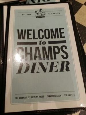 front of menu  at Champs Diner in Brooklyn