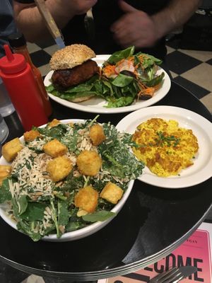 Hot chicken sandwich, kale Caesar, side of tofu scramble  at Champs Diner in Brooklyn