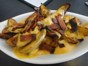 Fries with cheese and bacon at Champs - vegan :)  at Champs Diner in Brooklyn