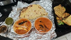 Vegan butter & Kadai chicken, parantha bread, & app platter at Ambrosia India Bistro in Monterey