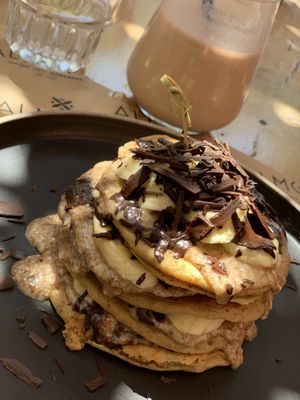 Vegan pancakes with PB, banana and chocolate flakes  at Almond in Paros
