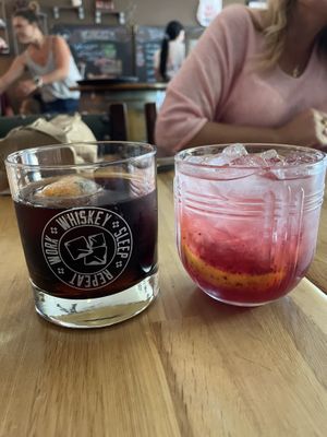 Bourbon and cola and a blackberry summer smash drink  at The Whiskey Coop in Sackets Harbor