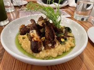 Smoke Sausage with Grits  at The Green House in Wilmington