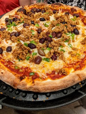 VEGAN Pizza with vegan cheese, vegan sausage, green peppers, onions, and kalamata olives! at Sergio's in Midlothian