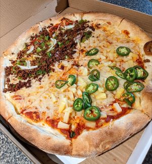 VEGAN pizza! First half: vegan beef, onions, and green peppers. Second half: pineapple and jalapeno. at Sergio's in Midlothian