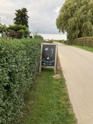 Sign indicating the ice cream shop, parking spot just around the corner at Gelato Farm Teuven in Voeren