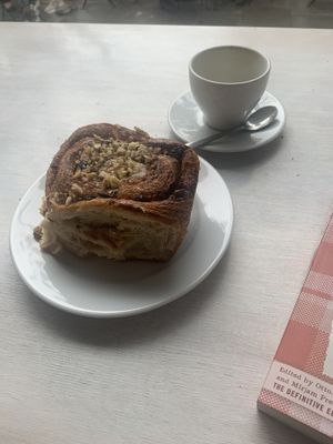 cinnamon bun & cappuccino  at Massolit Books & Café in Krakow