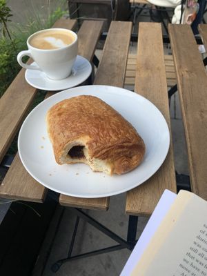pain au chocolat and latte  at Massolit Books & Café in Krakow
