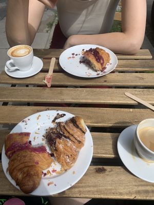Oat milk cappuccinos and berry, chocolate n Cherry croissants at Massolit Books & Café in Krakow