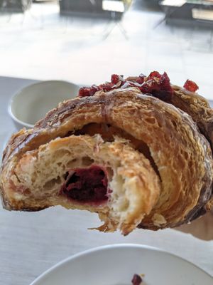 croissant with cherry filling at Massolit Books & Café in Krakow