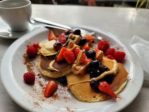 Pancakes with peanut butter and jam (no maple syrup) at Massolit Books & Café in Krakow