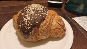 Croissant with chocolate and tahini at Massolit Books & Café in Krakow