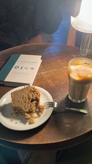 cake, drink, book  at Massolit Books & Café in Krakow