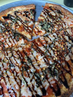 Cauliflower crust pizza with house-made marinara, vegan cheese, balsamic glaze, and red pepper flakes at Shotti's Point in Ocean City