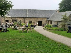 Outside seating and cafe entrance at Brewhouse Cafe - Seaton Delaval Hall in Seaton Sluice