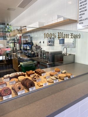 Signage on Point 100% Plant Based 🌱🥰✨  at Timeless Coffee - Webster in Oakland