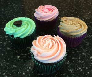 Vegan cupcakes for sale at the bakery. Clockwise from top: Pink Lace, Vanilla Latte, Strawberry Blonde, Grasshopper at Mason Jar Kitchen in Eagan