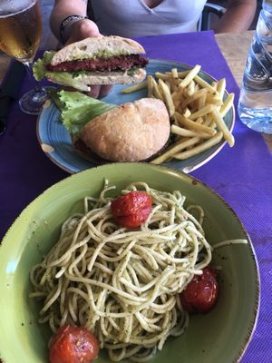 Vegan burger and pesto pasta   at Gusto BistroBar in Blanes