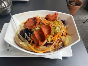 Baked Potato filled with Salad and Cigköfte  at Urfalim Cigköfte in Ulm