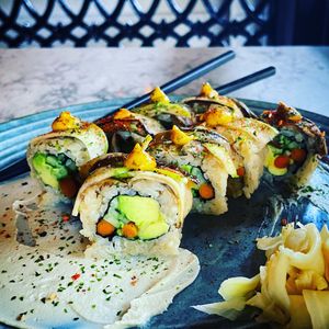 Vegan Nasamurai Roll: cucumber, avocado, pickled burdock root, miso glazed eggplant, candied apple, aji amarillo, nori, tofu-cashew wasabi cream at KAIYŌ in San Francisco