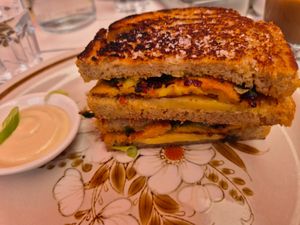 F*cking amazing toastie (spring onion chickpea pancake and cheddar with chilli oil) $18.00: tastes of chilli oil and salt only at Tyler's Milkbar in Preston