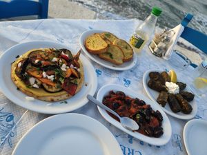 Vegan lahmazoum, garlic bread, olives in tomato sauce, dolmadakia at The Cellar Tavern in Crete