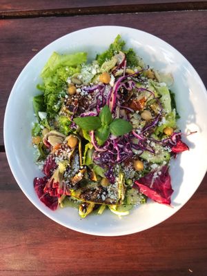 Zucchini and Feta Salad: Mixed leafy greens, honey chickpeas, pumpkin seeds, sliced almonds and kasoundi   at Papa Deluxe Baked Potato & Salad Bar - Tulum in Tulum