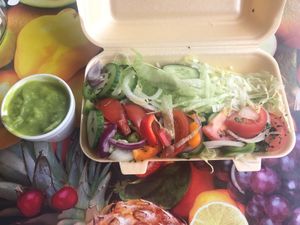 Side of mushy peas and a fresh side salad at Every Fish Bar in Harrow