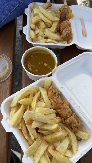 Battered sausage and chips  at The Harbour Chippy in Newquay