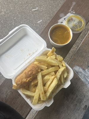 Tiny battered sausage, chips and curry sauce  at The Harbour Chippy in Newquay