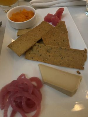 Cheese plate with homemade gluten free crackers at True Bistro in Somerville