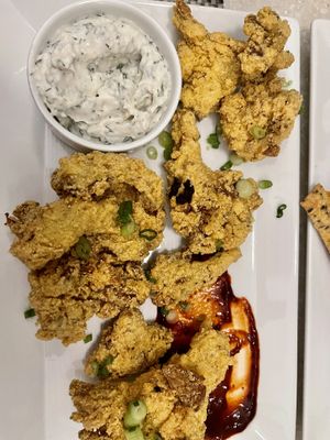 Oyster shroom fritters (vegan cream cheese on the side is amazing!)  at True Bistro in Somerville