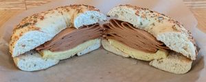 roasted garlic bagel with vegan egg and ham at Seize the Bagel - Orchards in Vancouver