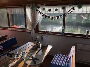 Inside with view of riber Raba at Paduc étterem in Sarvar