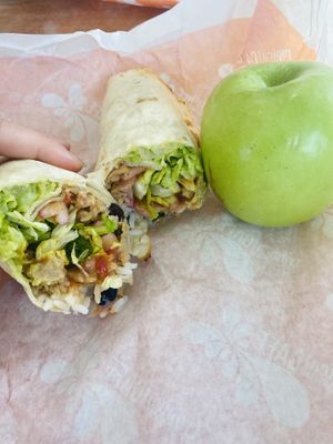 Plant-based chicken and no cheddar in my Baja wrap with an apple on the side!  at Tropical Smoothie Cafe in Jackson