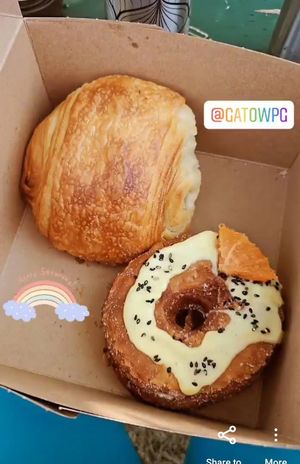 A pain au Chocolat and a citrus sesame cronut at Gâto in Winnipeg