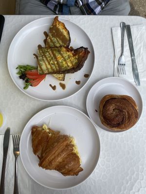 Egg and cheese croissant, cinnamon roll, and broccoli cauliflower and cheddar frittata   at Caffe Tosi in Saint Joseph