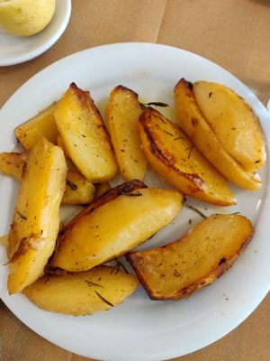Potatoes in the oven with lemon and herbs!  miam at To Stachi in Crete